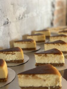 row cheesecakes table with brick wall them